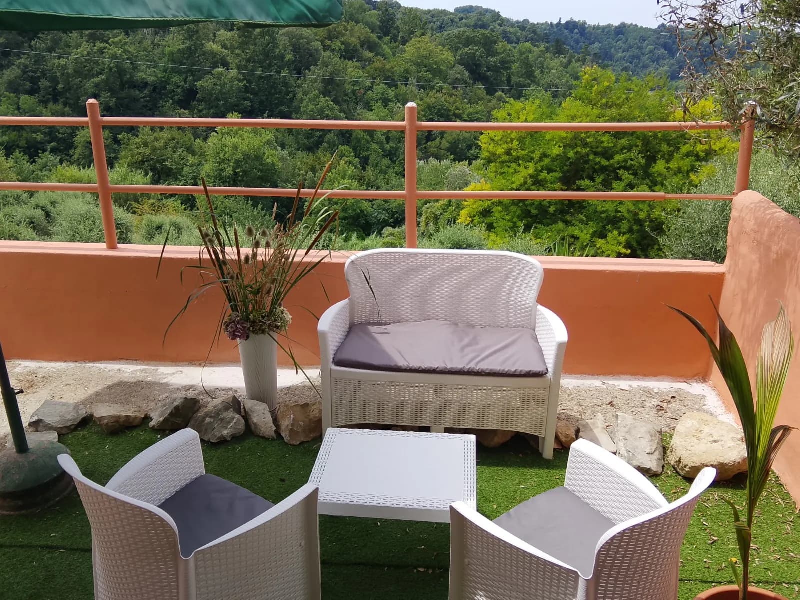 Outdoor space of Borgo Antico overlooking the green hills