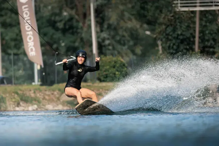 Wakeboarder jumping above the water during a session